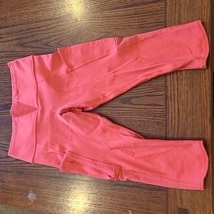 Salmonish pink capri length workout tights